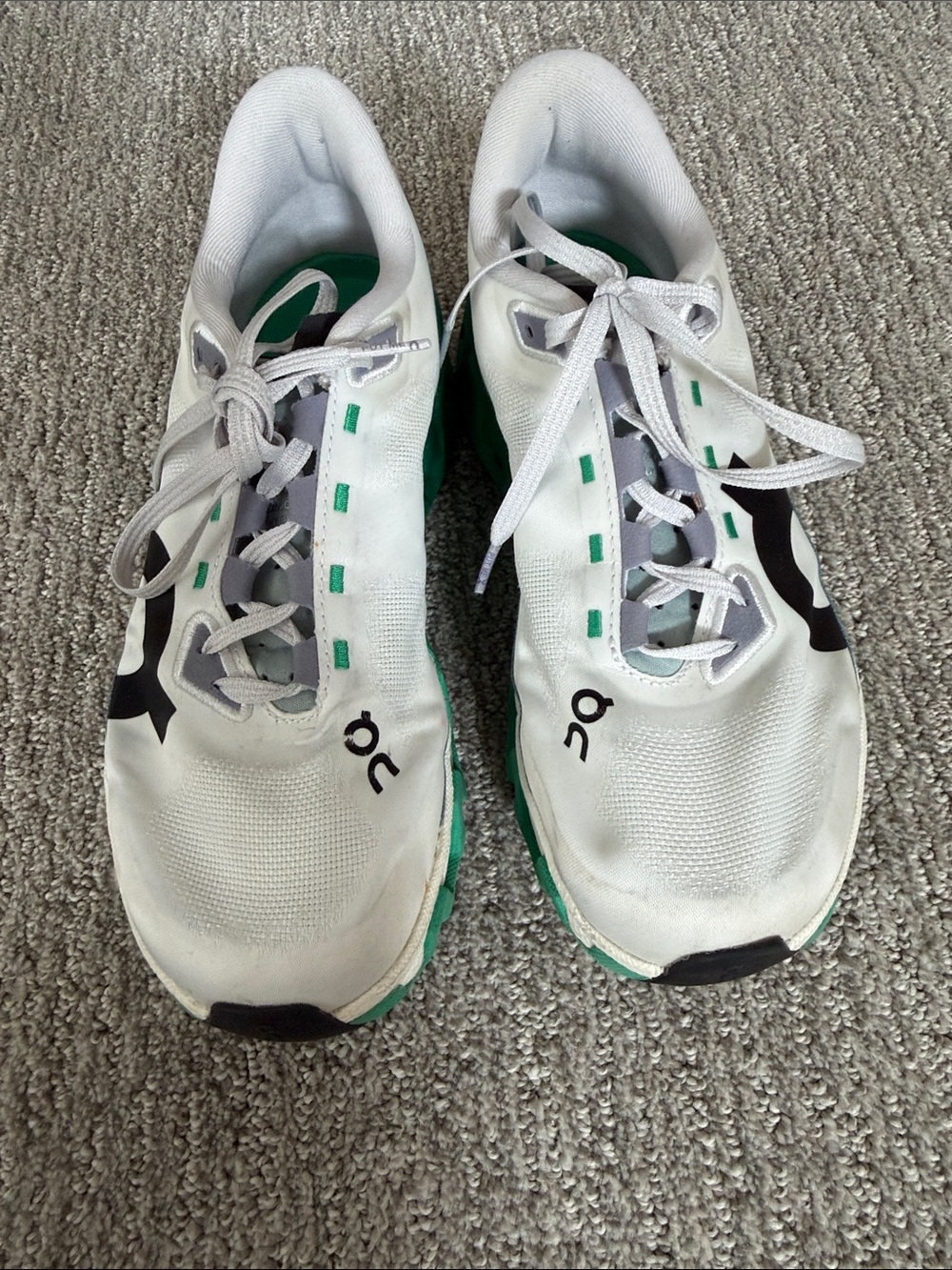 On Running White Sneakers with Green Sole and Teal Branding